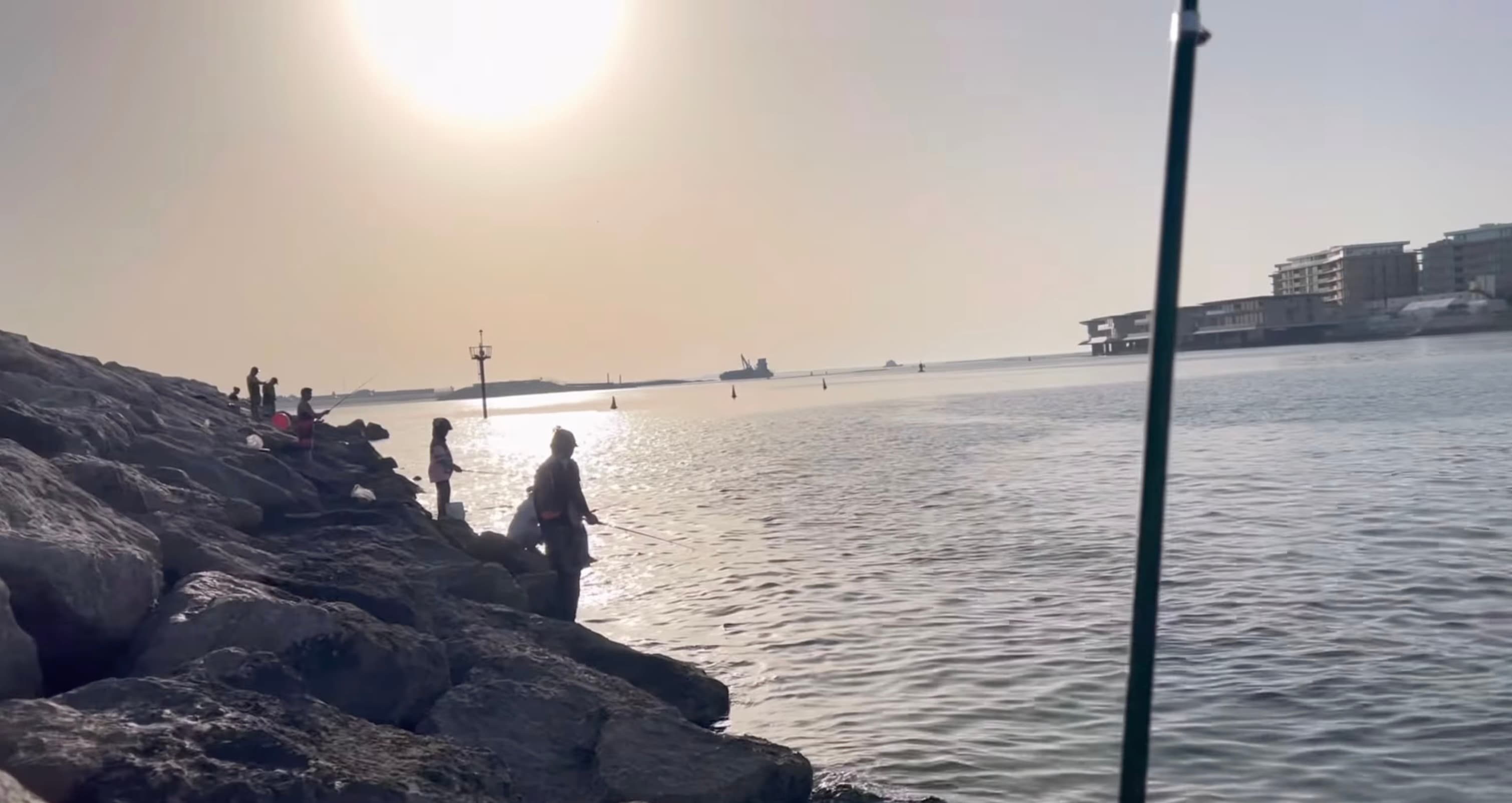 UAE anglers fishing at sunset
